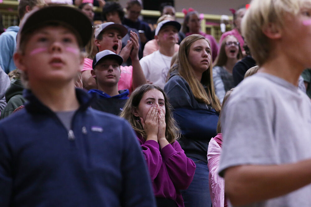 Sydney Hall covers her face with her hands during a close back and forth point